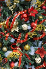 Closeup of Christmas ornaments and ribbon garland