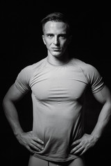 Portrait of bodybuilder shoor in studio on black background