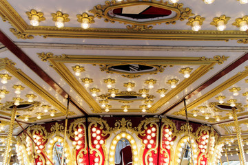 Vintage carousel horse; neon light detail at a luna park 
