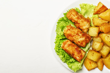 Fish and chips on white background, top view