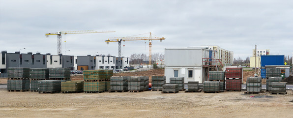 Panorama of a modern standard construction site in a small European city.