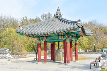 Fototapeta premium Korean architecture - colorful wooden gazebo painted in traditional Korean floral style 