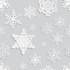 Christmas and New Year seamless pattern with white paper snowflakes. Winter seasonal holidays background. 3D paper art background