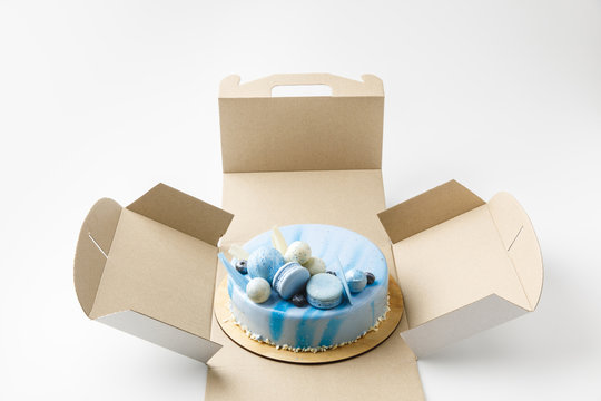 blue tasty cake in opened box isolated on white