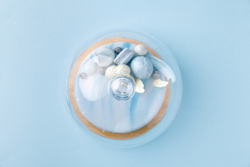 top view of blue tasty cake isolated on blue