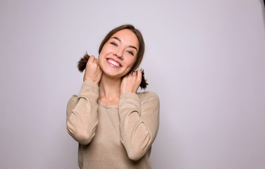 Beautiful smiling woman on light background