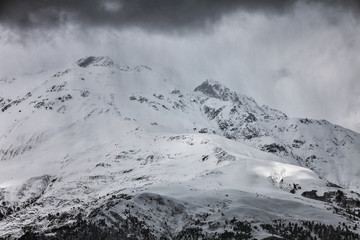 Panoramic view on snow winter mountains and cloud sky. Caucasus Mountains. Svaneti region of Georgia.