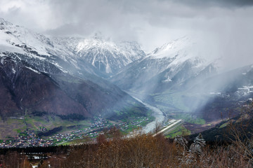 Panoramic view on snow winter mountains and cloud sky. Caucasus Mountains. Svaneti region of Georgia.