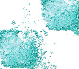 Fototapeta premium Crushed makeup on white background. The eye shadows.