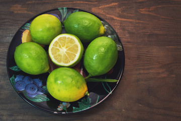 leech lime in black dish on wood background