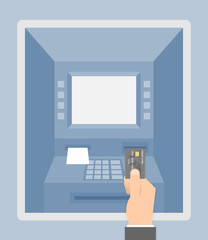 Hand pushing or putting credit card into the ATM machine