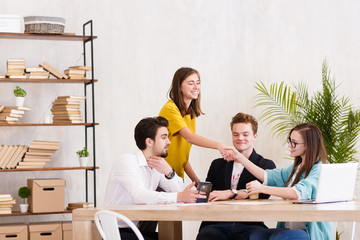 Team of young professionals works together