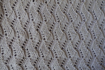 Grey handmade lacy knitted fabric from above