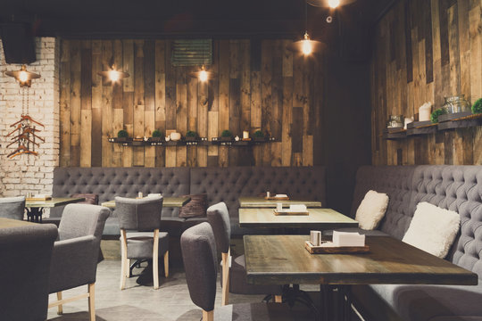 Cozy wooden interior of restaurant, copy space