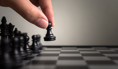 Plan leading strategy of successful business leader concept, Hand of player chess board game...