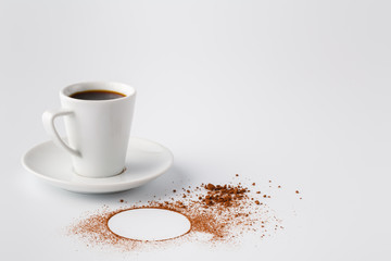 Circle of cocoa powder on white table