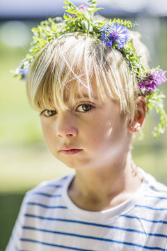 Portrait of girl wearing flower wreath