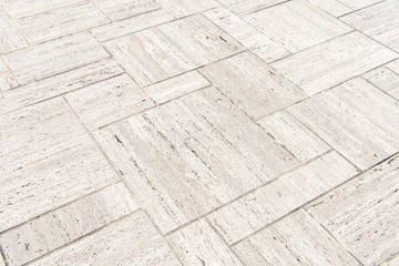 Naklejka premium patterned paving tiles, cement brick floor background.