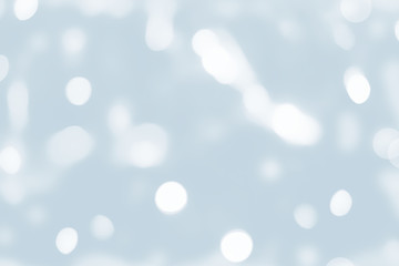 Festive holiday background with light delicate bokeh effect and drawing Decorative snow.