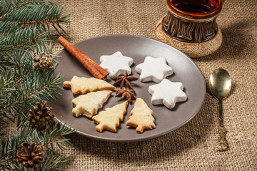 Gingerbread cookies in Christmas tree and star shape on plate