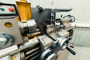 Modern lathe with manual control.