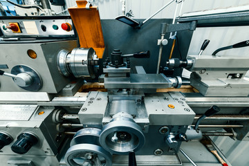Modern lathe with manual control.