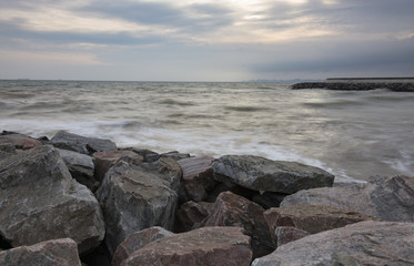 Fototapeta na wymiar Winter sea and huge stone coast 