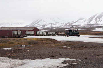 Old train and hut in Ny Alesund, Svalbard islands