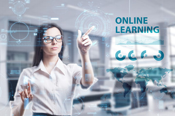 The concept of business, technology, the Internet and the network. A young entrepreneur working on a virtual screen of the future and sees the inscription: Online learning