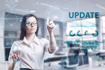 The concept of business, technology, the Internet and the network. A young entrepreneur working on a virtual screen of the future and sees the inscription: Update