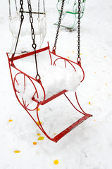 seat of merry-go-round with snow