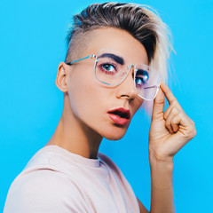Tomboy Model in stylish accessories.  Fashion glasses. Trends eyewear