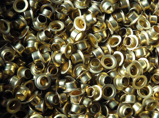 brass circular eyelets used in fashion and leather work