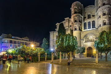 Fototapeta na wymiar Christmas light decorations around the cathedral in Malaga, Spain