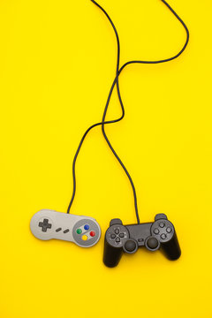 Fototapeta Retro computer gaming controllers on a bright yellow background