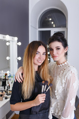 happy client and makeup artist