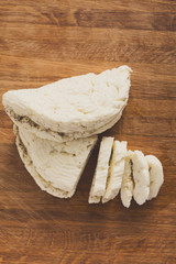 Homemade dairy, soft cheese, milk product on wood