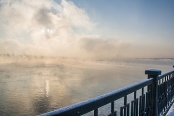 Naklejka na ściany i meble Frosty fog on the Yenisei river.
