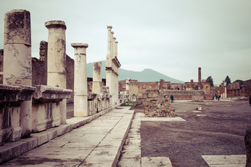 Fototapeta na wymiar The famous antique site of Pompeii, near Naples. It was completely destroyed by the eruption of Mount Vesuvius. One of the main tourist attractions in Italy.