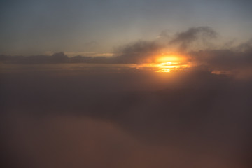Fototapeta na wymiar Orange sunset in the misty sky