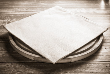 napkin and board on wooden background