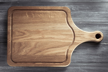 cutting board at wooden table