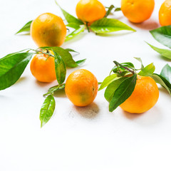Organic healthy tangerine mandarine wreath on a table