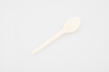 White plastic tea spoon isolated on white