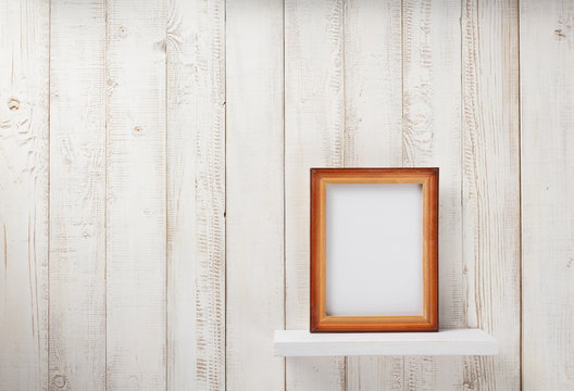 photo picture frame at wooden shel
