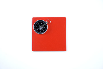 isolated compass and red board in white back ground