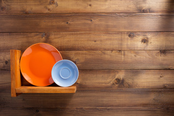 plate at kitchen wooden shelf at wall