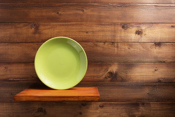 plate at kitchen wooden shelf at wall