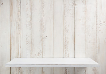 white shelf on wooden wall