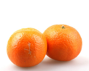 Fresh tangerine fruits on a white background
